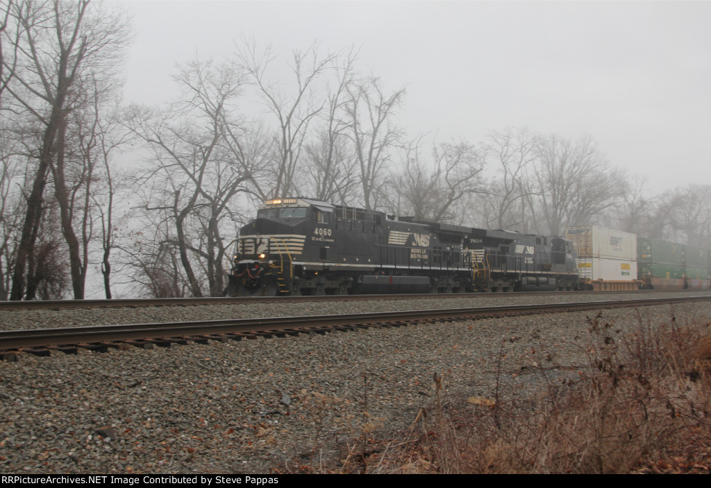 NS 4060 leads a stack train through MP 116 at Cove PA